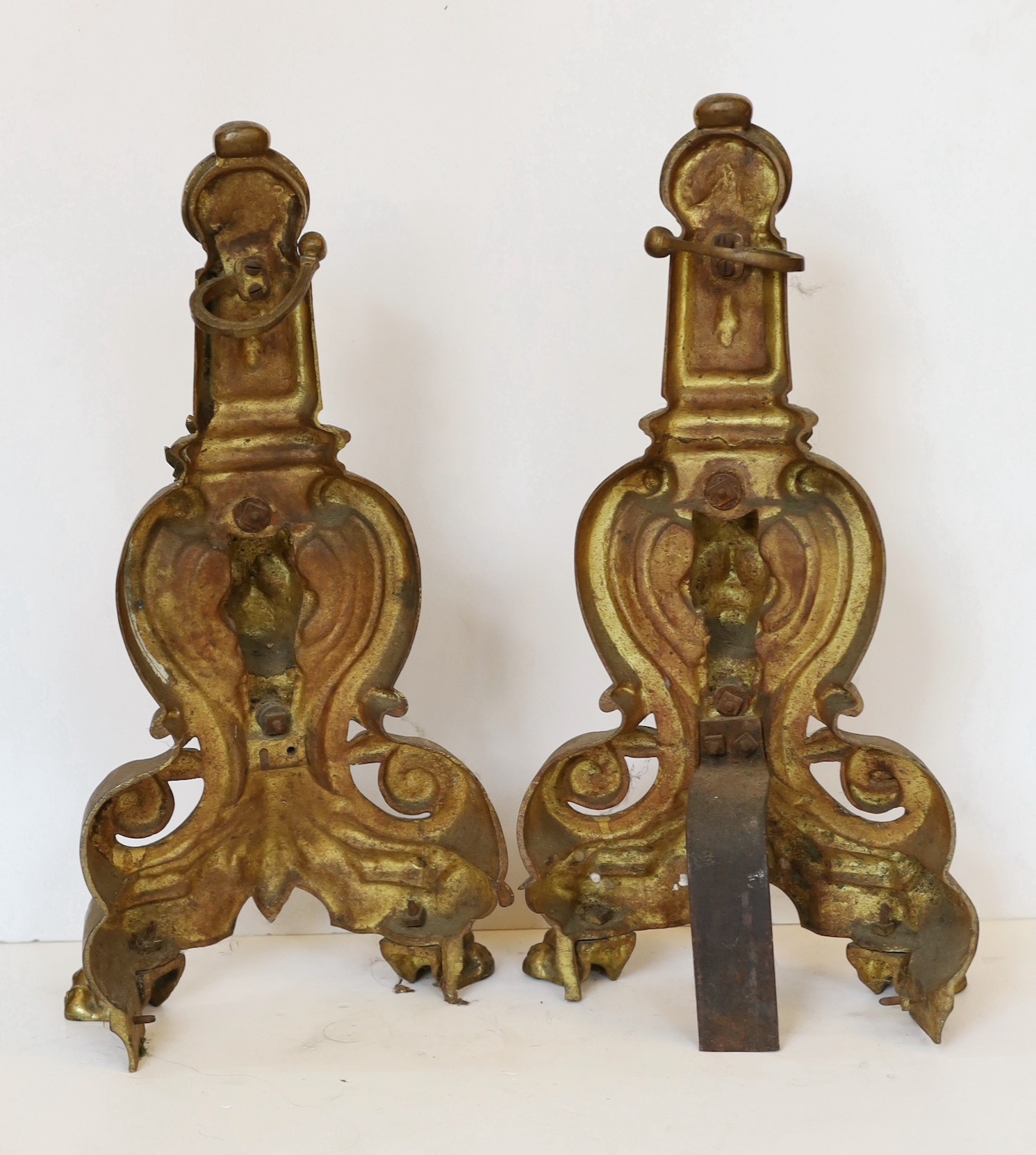 A pair of Louis XVI style gilt brass chenets, height 43cm